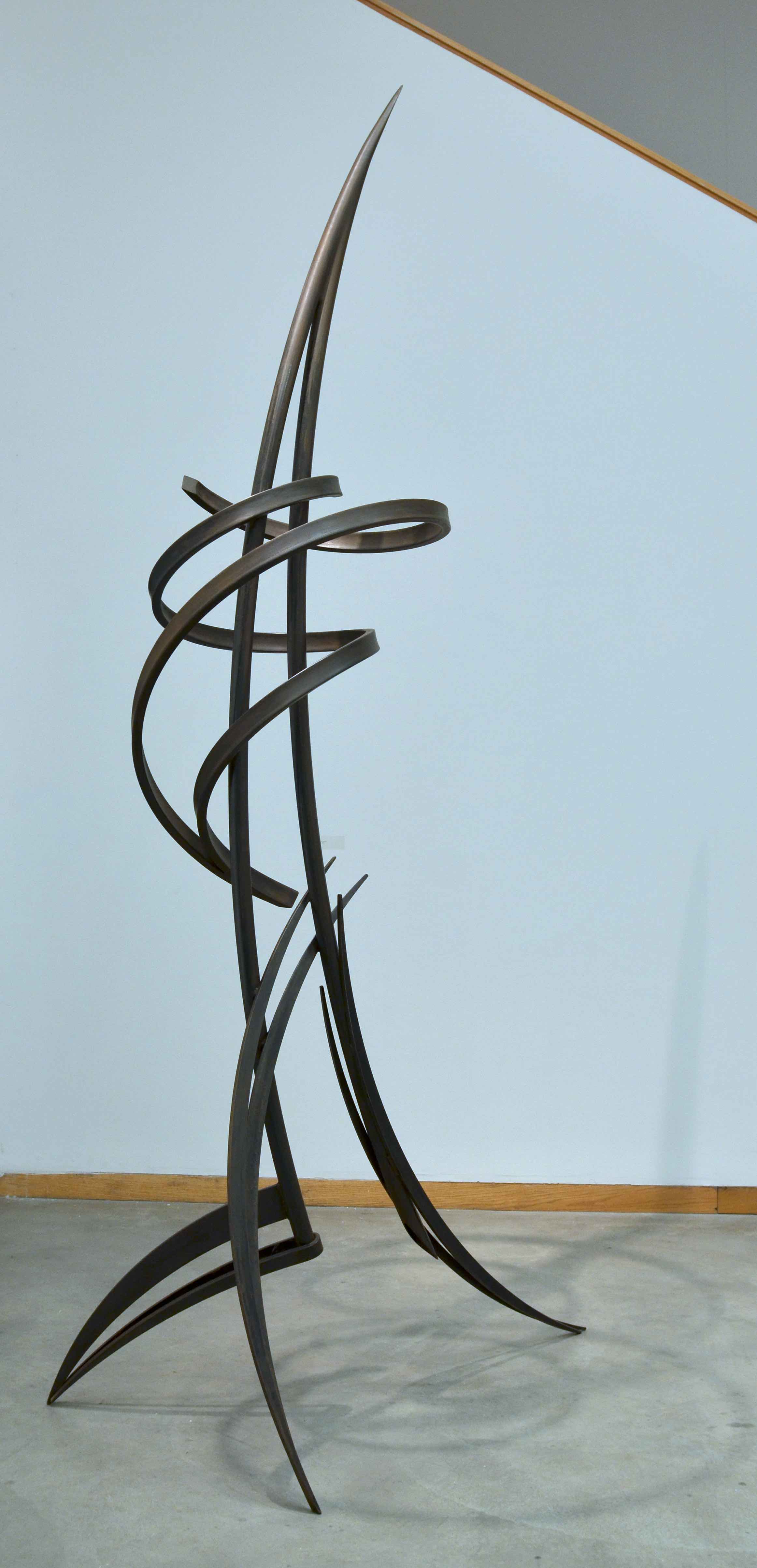 A black metal sculpture designed by Tony Armeni